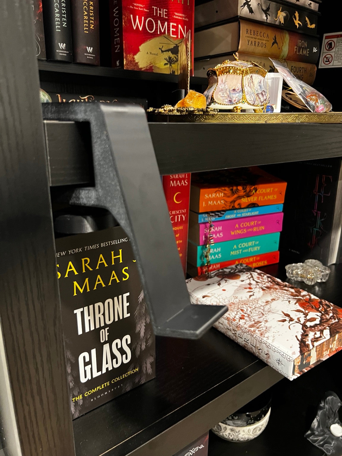 Black clamp-on book display with the interchangeable base removed